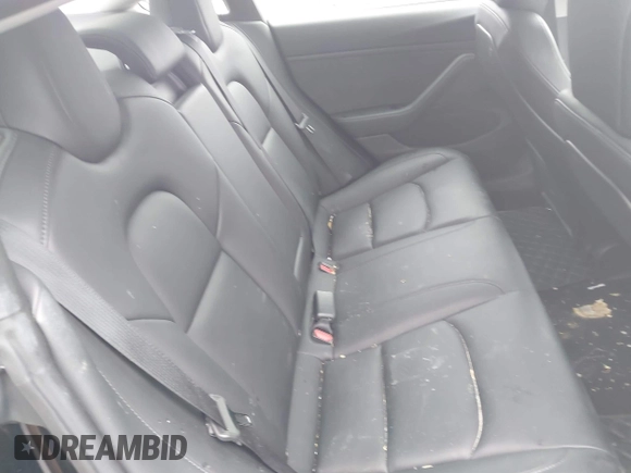 2019 Tesla Model 3 Mid Range with VIN 5YJ3E1EAXKF296378, listed as a IAAI auction lot 41739616 with 77,100 mi miles and . Bid and sale history available at DreamBid. Image 8.