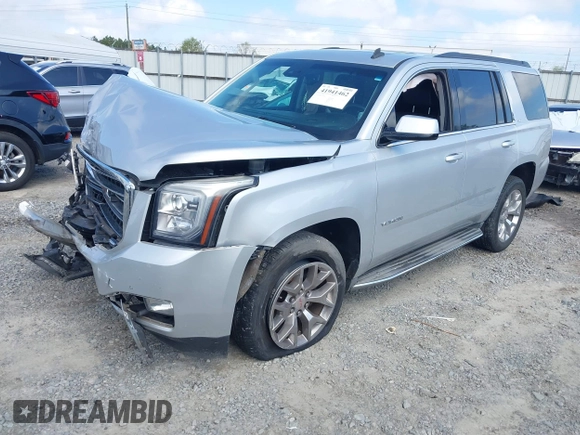 2015 GMC Yukon SLT z VIN 1GKS2BKC0FR100064, wystawiony jako IAAI lot #41941462 z przebiegiem 136 740 mil mil oraz . Historia ofert i sprzedaży dostępna na DreamBid. Obrazek 2.