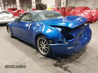 2005 Nissan 350Z Touring z VIN JN1AZ36A95M753704, wystawiony jako IAAI lot #41226946 z przebiegiem 94 351 mil mil oraz . Historia ofert i sprzedaży dostępna na DreamBid. Obrazek 3.