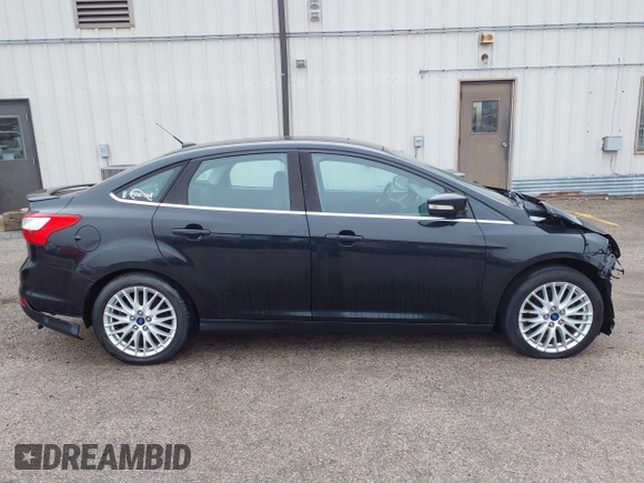 2014 Ford Focus Titanium with VIN 1FADP3J25EL310199, listed as a IAAI auction lot 40682901 with 84,885 mi miles and . Bid and sale history available at DreamBid. Image 15.