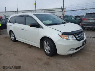 2013 Honda Odyssey Touring with VIN 5FNRL5H96DB089336, listed as a IAAI auction lot 41527990 with 128,770 mi miles. Bid and sale history available at carsss.com. Image 1.