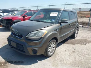 2012 Kia Soul + with VIN KNDJT2A69C7403710, listed as a IAAI auction lot 41916201 with 163,064 mi miles. Bid and sale history available at carsss.com. Image 2.
