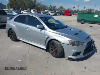 2013 Mitsubishi Lancer Evolution MR with VIN JA32W5FV6DU013470, listed as a IAAI auction lot 41544077 with 124,262 mi miles. Bid and sale history available at carsss.com. Image 1.
