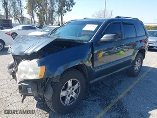 2007 Jeep Grand Cherokee Laredo with VIN 1J8HR48PX7C660601, listed as a IAAI auction lot 41652509 with 131,556 mi miles. Bid and sale history available at carsss.com. Image 18.