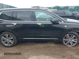 2020 Cadillac XT6 FWD Premium Luxury z VIN 1GYKPCRS6LZ148058, wystawiony jako IAAI lot #42416949 z przebiegiem 79 318 mil mil oraz . Historia ofert i sprzedaży dostępna na DreamBid. Obrazek 13.