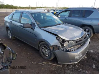 2008 Ford Focus SE with VIN 1FAHP35N98W165970, listed as a IAAI auction lot 42028598 with 242,004 mi miles and . Bid and sale history available at carsss.com. Image 1.