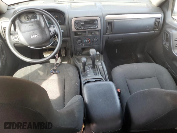 2004 Jeep Grand Cherokee Laredo z VIN 1J4GW48S24C220989, wystawiony jako Copart lot #56759465 z przebiegiem 227 612 mil mil oraz Szkoda całkowita • Salvage title. Historia ofert i sprzedaży dostępna na DreamBid. Obrazek 8.