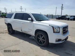 2016 GMC Yukon XL SLT with VIN 1GKS2GKC6GR228033, listed as a Copart auction lot 52450055 with 135,476 mi miles and Salvage Title. Bid and sale history available at DreamBid. Image 4.