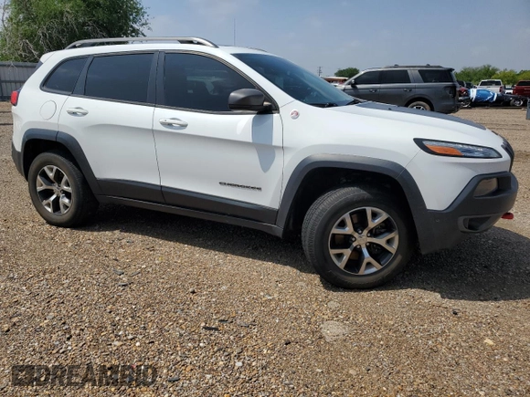 2014 Jeep Cherokee Trailhawk with VIN 1C4PJMBS9EW140344, listed as a Copart auction lot 50579005 with 117,326 mi miles and Salvage Title. Bid and sale history available at carsss.com. Image 4.
