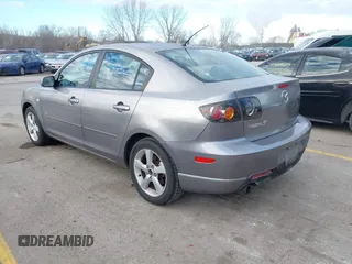 2005 Mazda 3 s with VIN JM1BK323551245843, listed as a IAAI auction lot 41860274 with 166,579 mi miles. Bid and sale history available at carsss.com. Image 3.