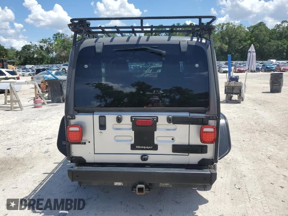 2005 Jeep Wrangler Sport z VIN 1J4FA49S75P324462, wystawiony jako Copart lot #59818995 z przebiegiem 183 558 mil mil oraz Nie do naprawy • Non repairable. Historia ofert i sprzedaży dostępna na DreamBid. Obrazek 6.