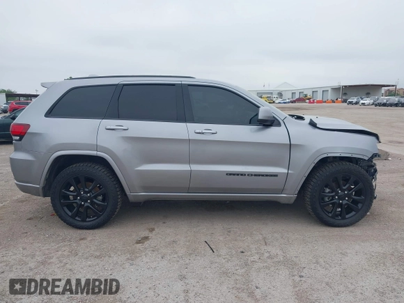 2019 Jeep Grand Cherokee Laredo E with VIN 1C4RJFAG9KC670974, listed as a IAAI auction lot 42333028 with 163,958 mi miles and . Bid and sale history available at DreamBid. Image 14.
