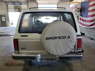 1990 Ford Bronco z VIN 1FMCU14T9LUA62663, wystawiony jako Copart lot #85040114 z przebiegiem 9 963 mil mil oraz Czysty tytuł • Clean title. Historia ofert i sprzedaży dostępna na DreamBid. Obrazek 6.