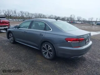 2021 Volkswagen Passat 2.0T SE with VIN 1VWSA7A3XMC011113, listed as a IAAI auction lot 41942881 with 63,753 mi miles. Bid and sale history available at carsss.com. Image 3.