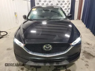 2018 Mazda CX-5 Touring with VIN JM3KFACM7J1452929, listed as a Copart auction lot 51945625 with 93,133 mi miles and Clean Title. Bid and sale history available at carsss.com. Image 5.