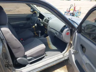 2005 Hyundai Accent GLS z VIN KMHCG35C65U366635, wystawiony jako IAAI lot #42389348 z przebiegiem 65 872 mil mil oraz . Historia ofert i sprzedaży dostępna na DreamBid. Obrazek 5.