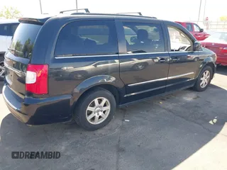 2011 Chrysler Town & Country Touring with VIN 2A4RR5DG2BR702731, listed as a IAAI auction lot 42095661 with 202,968 mi miles and . Bid and sale history available at DreamBid. Image 4.