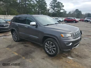 2017 Jeep Grand Cherokee Overland with VIN 1C4RJECG2HC903366, listed as a Copart auction lot 44140155 with 102,459 mi miles and Salvage Title. Bid and sale history available at carsss.com. Image 4.