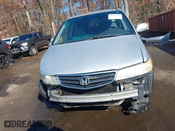 2004 Honda Odyssey EX z VIN 5FNRL18674B080319, wystawiony jako IAAI lot #40819411 z przebiegiem 201 820 mil mil oraz . Historia ofert i sprzedaży dostępna na DreamBid. Obrazek 13.