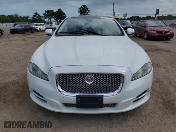 2015 Jaguar XJ with VIN SAJWA1CZ9F8V82974, listed as a Copart auction lot 59364344 with 64,012 mi miles and Salvage Title. Bid and sale history available at carsss.com. Image 5.