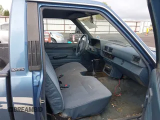 1988 Toyota Pickup with VIN JT4RN50R5J5169942, listed as a IAAI auction lot 42152517 with 218,579 mi miles and . Bid and sale history available at DreamBid. Image 5.