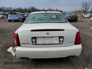 2003 Cadillac DeVille DTS z VIN 1G6KF57993U201484, wystawiony jako Copart lot #43742375 z przebiegiem 53 478 mil mil oraz Szkody całkowita. Historia ofert i sprzedaży dostępna na DreamBid. Obrazek 6.