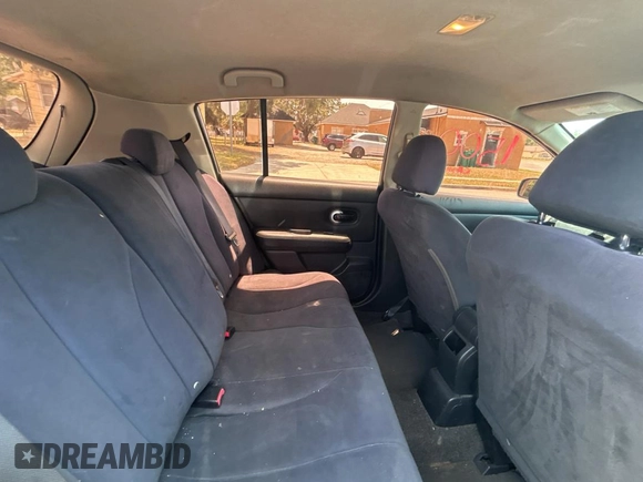 2009 Nissan Versa S with VIN 3N1BC13E19L499018, listed as a Copart auction lot 56711385 with 196,451 mi miles and Clean Title. Bid and sale history available at DreamBid. Image 6.