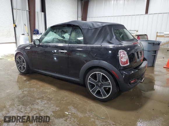 2013 MINI Convertible S with VIN WMWZP3C51DT297891, listed as a Copart auction lot 56745065 with 101,292 mi miles and Salvage title. Bid and sale history available at DreamBid. Image 2.