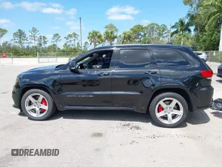 2017 Jeep Grand Cherokee SRT z VIN 1C4RJFDJ8HC653924, wystawiony jako IAAI lot #42108099 z przebiegiem 61 560 mil mil oraz . Historia ofert i sprzedaży dostępna na DreamBid. Obrazek 14.