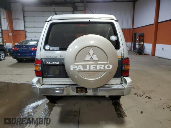 1995 Mitsubishi Montero z VIN 2BGF0126264046653, wystawiony jako Copart lot #81135584 z przebiegiem 254 106 mil mil oraz Czysty tytuł • Clean title. Historia ofert i sprzedaży dostępna na DreamBid. Obrazek 6.