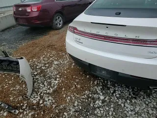 2016 Lincoln MKZ Hybrid с VIN 3LN6L2LU6GR631594, выставлен на аукционе Copart как лот 56802665 с пробегом 130 871 миль миль и Списание • Salvage title. История ставок и продаж доступна на DreamBid. Изображение 14.