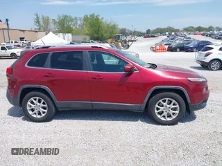 2014 Jeep Cherokee Altitude with VIN 1C4PJMCB7EW185958, listed as a IAAI auction lot 42002583 with 118,256 mi miles and . Bid and sale history available at DreamBid. Image 13.
