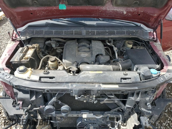 2005 Nissan Titan LE z VIN 1N6AA07B85N556721, wystawiony jako Copart lot #56566275 z przebiegiem 161 847 mil mil oraz Szkoda całkowita • Salvage title. Historia ofert i sprzedaży dostępna na DreamBid. Obrazek 11.