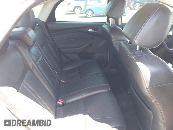 2013 Ford Focus SE z VIN 1FADP3F25DL164555, wystawiony jako IAAI lot #41945007 z przebiegiem 119 699 mil mil oraz . Historia ofert i sprzedaży dostępna na DreamBid. Obrazek 8.