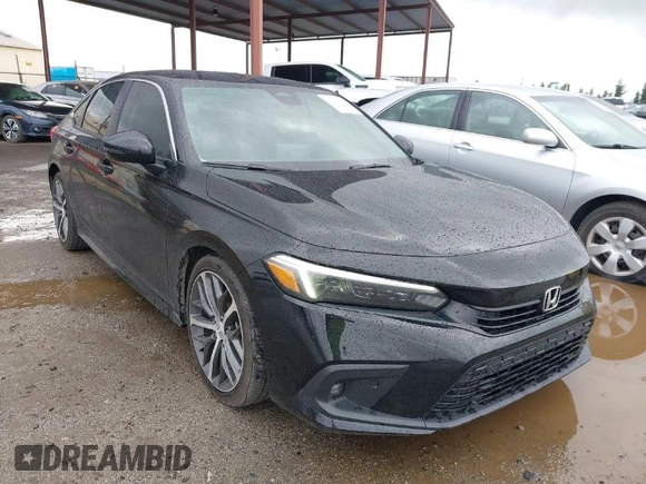 2022 Honda Civic Sedan Touring with VIN 2HGFE1F93NH302409, listed as a IAAI auction lot 41719494 with 34,129 mi miles. Bid and sale history available at carsss.com. Image 1.