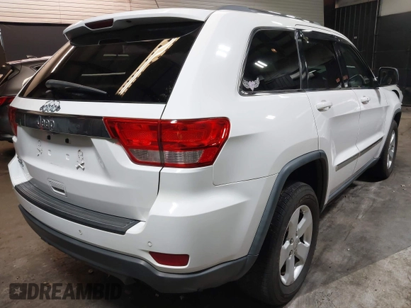2013 Jeep Grand Cherokee Laredo with VIN 1C4RJFAG9DC532919, listed as a IAAI auction lot 40918828 with 140,093 mi miles. Bid and sale history available at carsss.com. Image 4.