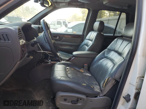 2002 GMC Envoy SLT with VIN 1GKDS13S822460095, listed as a Copart auction lot 77004764 with 267,716 mi miles and Salvage Title. Bid and sale history available at carsss.com. Image 7.