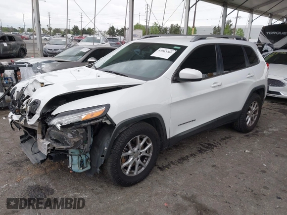 2015 Jeep Cherokee Latitude with VIN 1C4PJLCB5FW642701, listed as a IAAI auction lot 42063262 with 142,501 mi miles and . Bid and sale history available at carsss.com. Image 2.