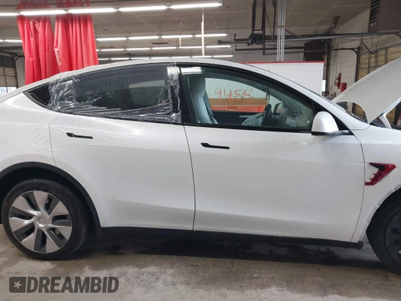 2023 Tesla Model Y Long Range with VIN 7SAYGDEE7PA100523, listed as a IAAI auction lot 40399455 with 18,885 mi miles and . Bid and sale history available at DreamBid. Image 13.