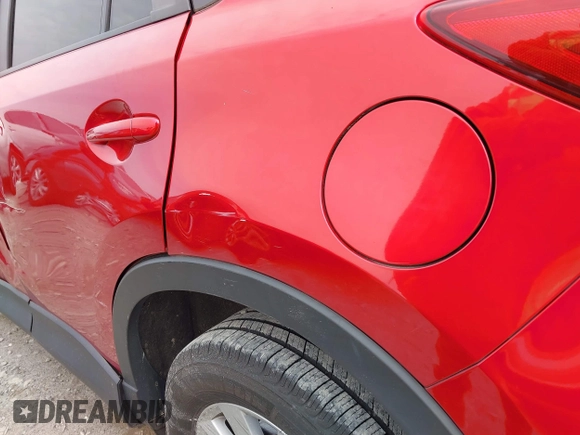 2016 Mazda CX-5 Touring z VIN JM3KE2CY3G0894441, wystawiony jako IAAI lot #41508767 z przebiegiem 88 554 mil mil oraz . Historia ofert i sprzedaży dostępna na DreamBid. Obrazek 18.