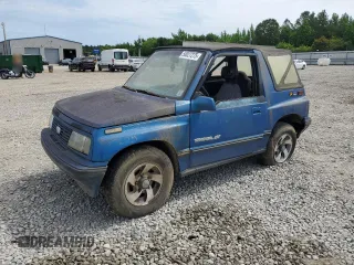1993 Geo Tracker z VIN 2CNBJ18UXP6921660, wystawiony jako Copart lot #58027275 z przebiegiem 64 349 mil mil oraz Tytuł czysty. Historia ofert i sprzedaży dostępna na DreamBid. Obrazek 1.