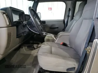 2004 Jeep Wrangler Sahara with VIN 1J4FA59S14P770952, listed as a Copart auction lot 66498694 with 112,649 mi miles and Salvage Title. Bid and sale history available at carsss.com. Image 7.