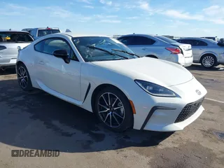 2023 Toyota GR86 with VIN JF1ZNBC18P8763197, listed as a IAAI auction lot 41651340 with 33,759 mi miles. Bid and sale history available at carsss.com. Image 1.
