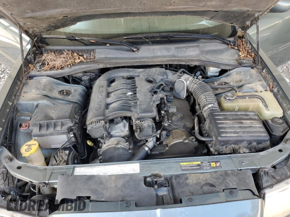2005 Chrysler 300 Touring z VIN 2C3JA53G65H574021, wystawiony jako Copart lot #70073414 z przebiegiem 291 219 mil mil oraz Szkoda całkowita • Salvage title. Historia ofert i sprzedaży dostępna na DreamBid. Obrazek 11.