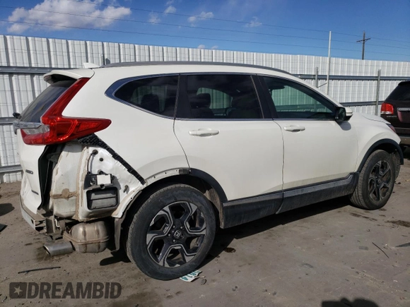 2018 Honda CR-V Touring with VIN 5J6RW2H95JL030237, listed as a Copart auction lot 44001415 with 55,575 mi miles and Salvage Title. Bid and sale history available at DreamBid. Image 3.