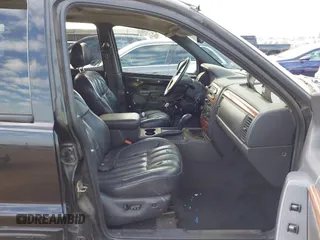 1999 Jeep Grand Cherokee Limited with VIN 1J4GW68NXXC637464, listed as a IAAI auction lot 41561690 with 235,728 mi miles. Bid and sale history available at carsss.com. Image 5.