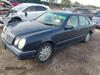1999 Mercedes-Benz E-Class with VIN WDBJF65H1XA817789, listed as a IAAI auction lot 41818511 with 999,999 mi miles. Bid and sale history available at carsss.com. Image 2.