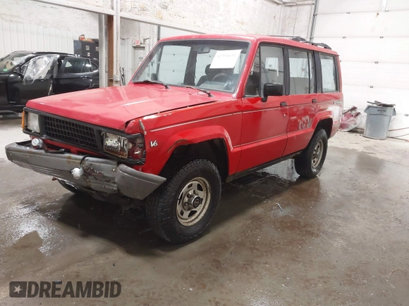 1991 Isuzu Trooper z VIN JACCH58R6M8905869, wystawiony jako IAAI lot #42394651 z przebiegiem 117 130 mil mil oraz . Historia ofert i sprzedaży dostępna na DreamBid. Obrazek 2.