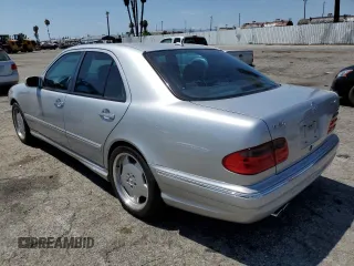 2000 Mercedes-Benz E with VIN WDBJF74J7YB055624, listed as a Copart auction lot 63880184 with 71,355 mi miles and Salvage Title. Bid and sale history available at DreamBid. Image 2.