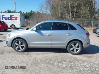 2015 Audi Q3 2.0T Premium Plus with VIN WA1EFCFSXFR010015, listed as a IAAI auction lot 42099410 with 142,117 mi miles. Bid and sale history available at carsss.com. Image 14.